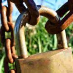 not fully secure - padlock on a gate